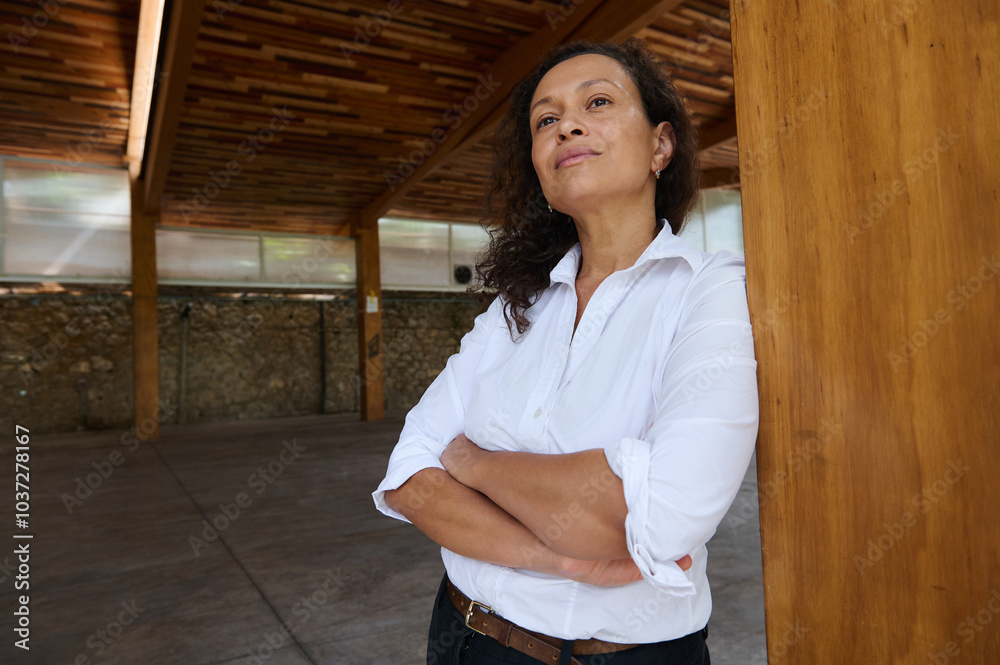 Confident businesswoman standing poised in a modern wooden interior space Confident businesswoman standing poised in a modern wooden interior space