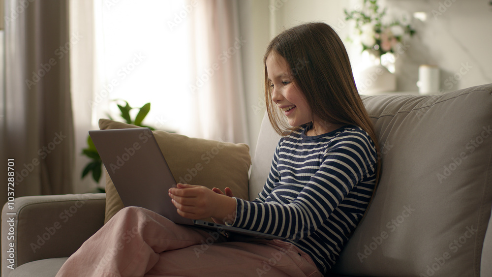 Little girl using laptop desktop computer pc technology gadget child daughter preteen texting typing device cyberspace kid networking home funny communicating browse virtual e-learning online educate Little girl using laptop desktop computer pc technology gadget child daughter preteen texting typing device cyberspace kid networking home funny communicating browse virtual e-learning online educate