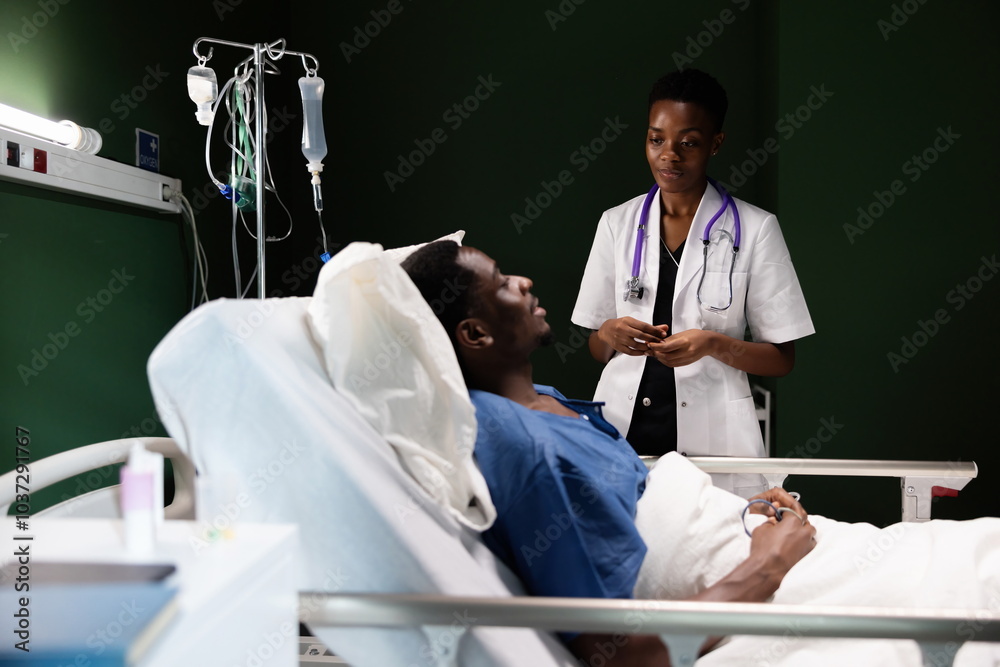 African doctor stands by the bedside, having a simple and comforting chat with the patient. African doctor stands by the bedside, having a simple and comforting chat with the patient.