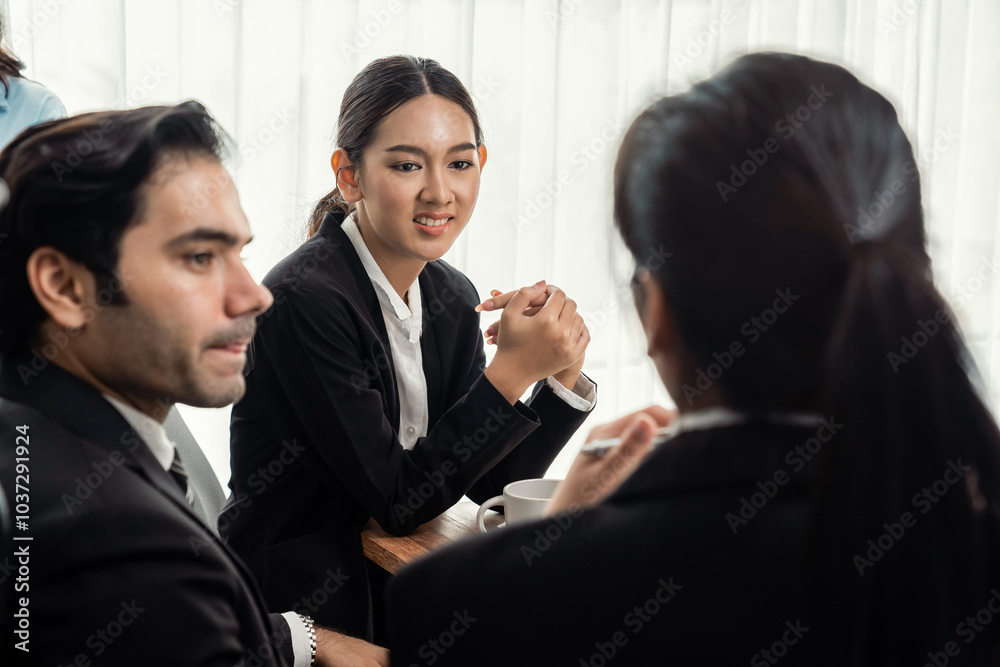 Diverse of business people from various ethnic group working in modern office environment. Productive and multi ethnic office workers engage in discussion for strategic business marketing. Meticulous Diverse of business people from various ethnic group working in modern office environment. Productive and multi ethnic office workers engage in discussion for strategic business marketing. Meticulous