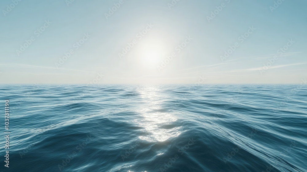 Obraz premium A serene sea surface with light waves gently moving under the afternoon sun, creating smooth reflections.