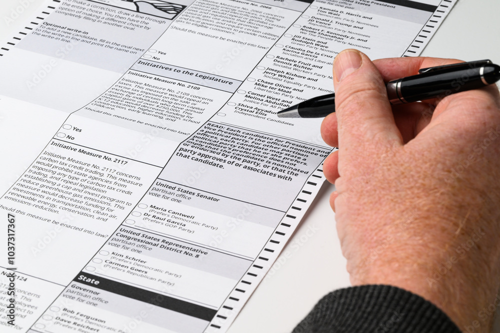 Obraz premium Absentee voter holding pen in hand choosing in US General Election