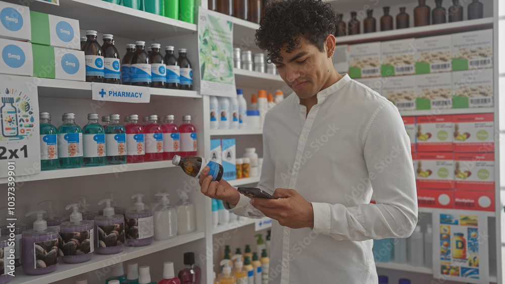 Hispanic man examining product using smartphone in brightly-lit pharmacy Hispanic man examining product using smartphone in brightly-lit pharmacy