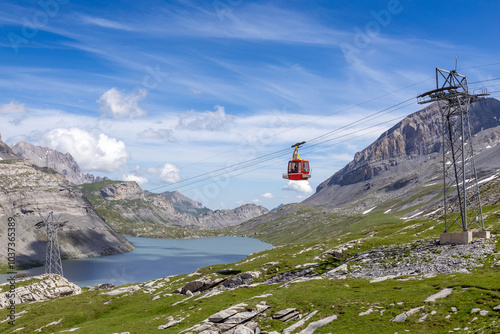 mountain landscape with lake and a gondola in summer, in Gemmi Leukerbad, Switzerland photo