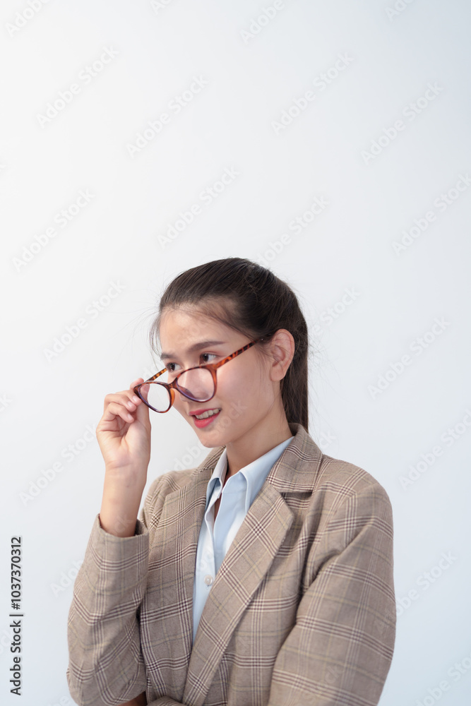 Beautiful asian young Business woman with eyeglasses smiling on a white background Beautiful asian young Business woman with eyeglasses smiling on a white background