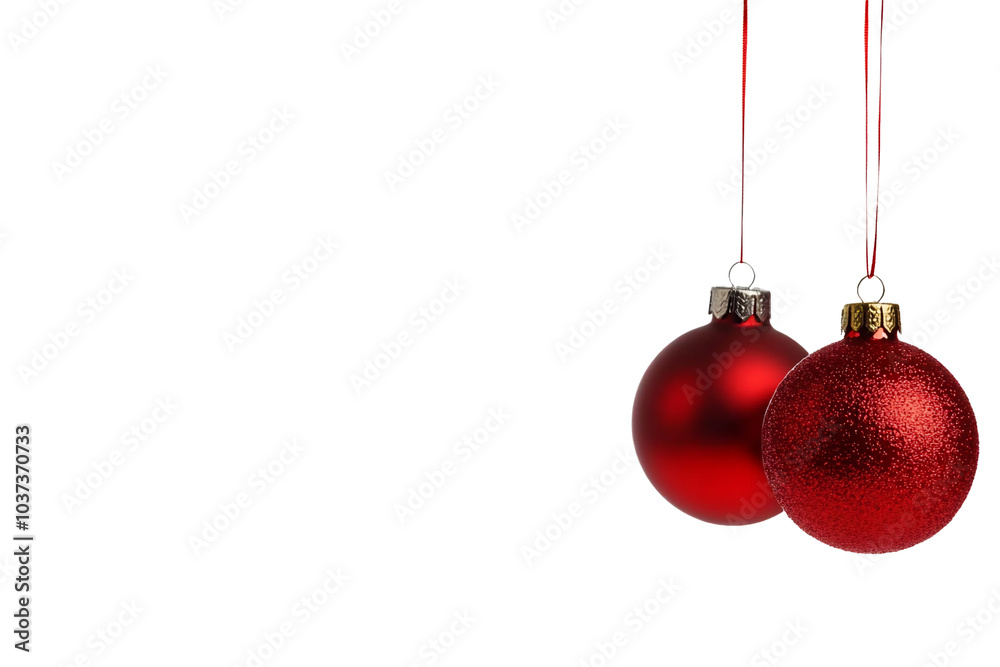 Two red Christmas ornaments hanging, one shiny and one glittery. Two red Christmas ornaments hanging, one shiny and one glittery.