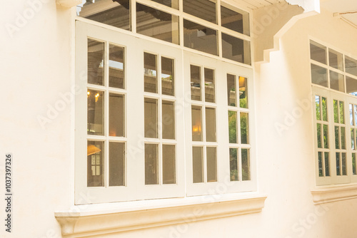 Cozy house exterior with wooden casement window and white wall rendering,Large estate home building Window Frame,minimal home concept.