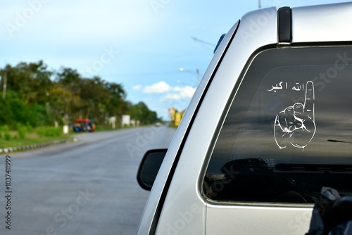 back of wite car with Allahu Akbar in Patani