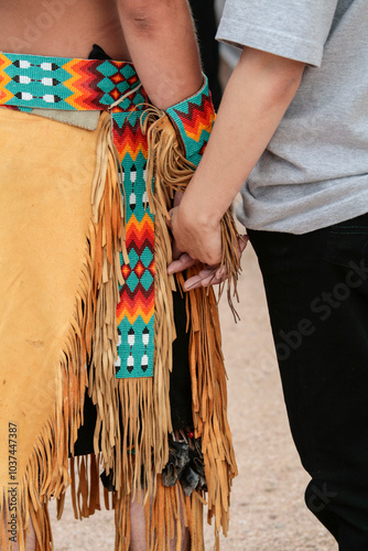 Ohkay Owingeh Pueblo, New Mexico, USA.  Feast day dances, couple holding hands.  photo