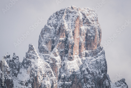 Close-up of snowdrifts on a snowy peak close to the Croda Rossa d'Ampezzo on a sunny day with a blue sky in the Dolomites. View from the Forte di Prato Piazza on Duerrenstein. photo