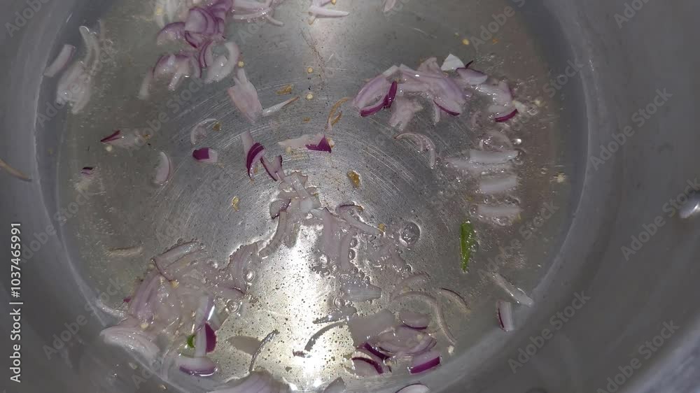 A footage of frying fresh onions in an oil. Deep frying onions. 