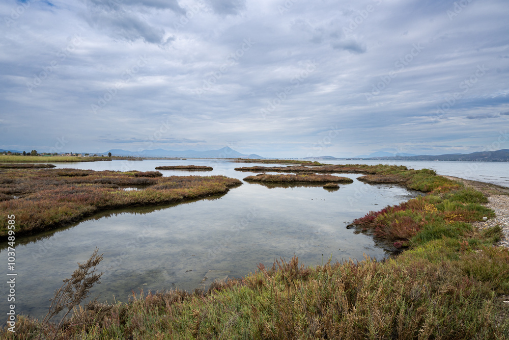 Beautiful landscape of a lagoon at Greece. Cloudy sky at the background. Beautiful landscape of a lagoon at Greece. Cloudy sky at the background.