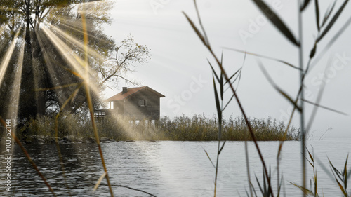 Schilderij op canvas Tiny house by the lake in shot in an early morning with sunrays striking towards the weter