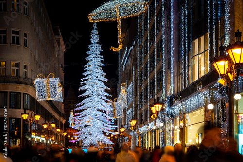 Canvas Print Festive Christmas lights on a busy Budapest shopping street at night
