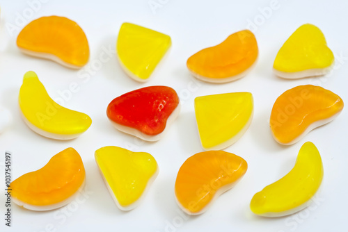 Fresh jelly fruit candies on the white background photo