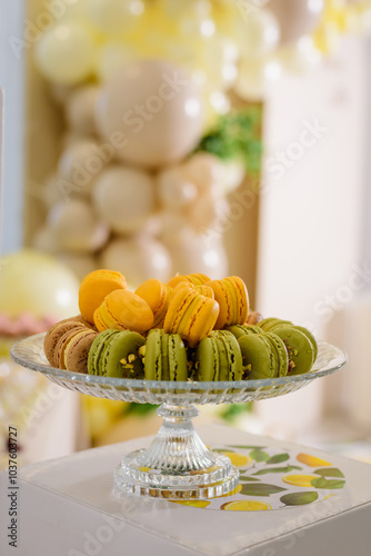 Green and yellow macaroons on the candy bar