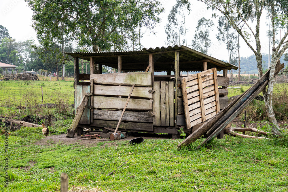 Rustic rural building in old wood for raising pigs and chickens Rustic rural building in old wood for raising pigs and chickens