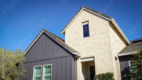 Top of a two toned house. Stone and Board and Batten