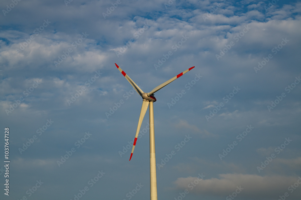 Windmills turbines generating electricity. Green energy. Turbine farm. Renewable energy source. Windmills turbines generating electricity. Green energy. Turbine farm. Renewable energy source.