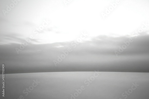 A Minimalist Black and White Landscape with Overcast Skies photo