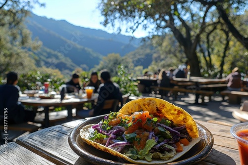 A Taco With a Mountain View at a Rustic Outdoor Table