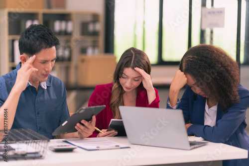 Company meeting A diverse team of frustrated businessmen feels hopeless due to poor results or poor statistics. Disgruntled co-workers shocked by negative bankruptcy news