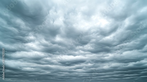 A sky covered in stratus clouds, creating a smooth, overcast look on a cool, cloudy day