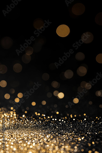  Abstract dark background with sparkling golden bokeh lights and glitter dust particles, banner. AI generation.