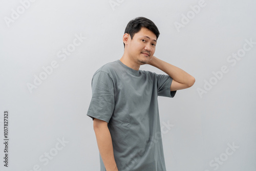 Happy expression of adult Asian man with casual t-shirt isolated on white background