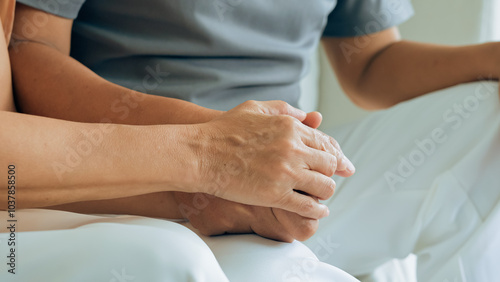 Close up view of caring elderly grandma wife holding hand supporting senior grandpa husband give empathy care love, old married grandparents couple together