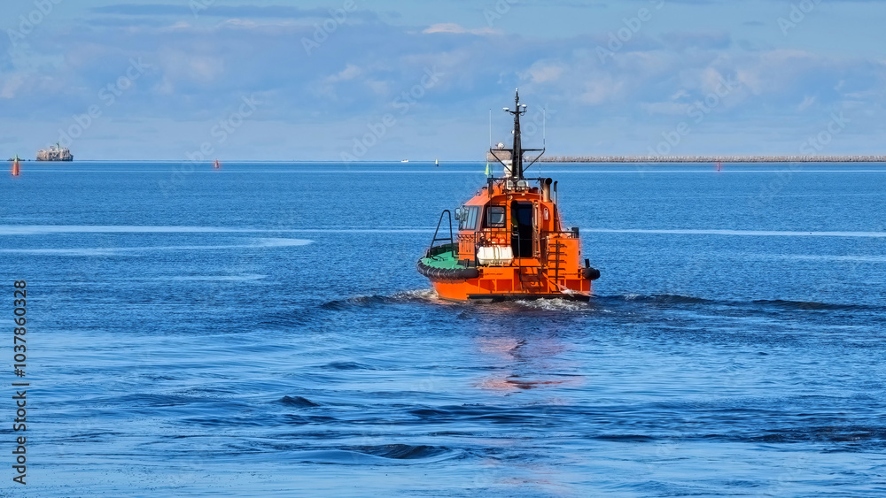 Fototapeta premium A pilot boat goes to meet a ship.
