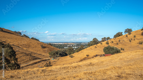landscape in the mountains, city, blue sky  and the valley 