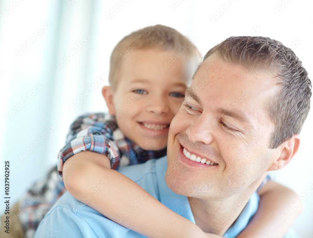 Happy, father and child hug in family home with fun, bonding and love in living room. Smile, play wrestling and youth with parent care, support and piggy back game with kid and embrace together Happy, father and child hug in family home with fun, bonding and love in living room. Smile, play wrestling and youth with parent care, support and piggy back game with kid and embrace together