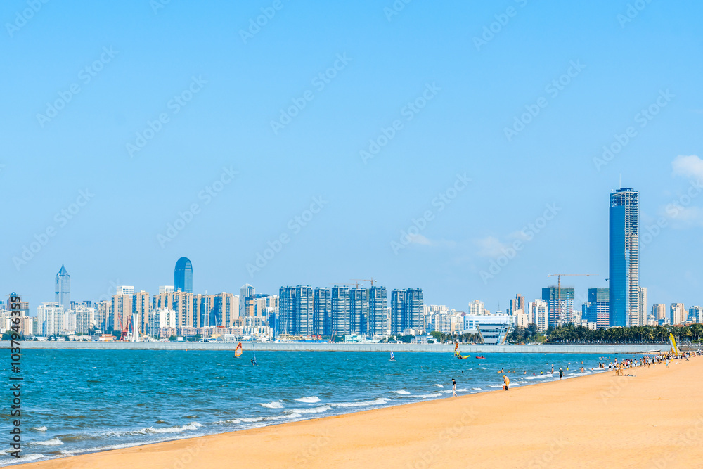 Scenery of Holiday Beach and West Coast Tall Buildings in Haikou, Hainan, China Scenery of Holiday Beach and West Coast Tall Buildings in Haikou, Hainan, China