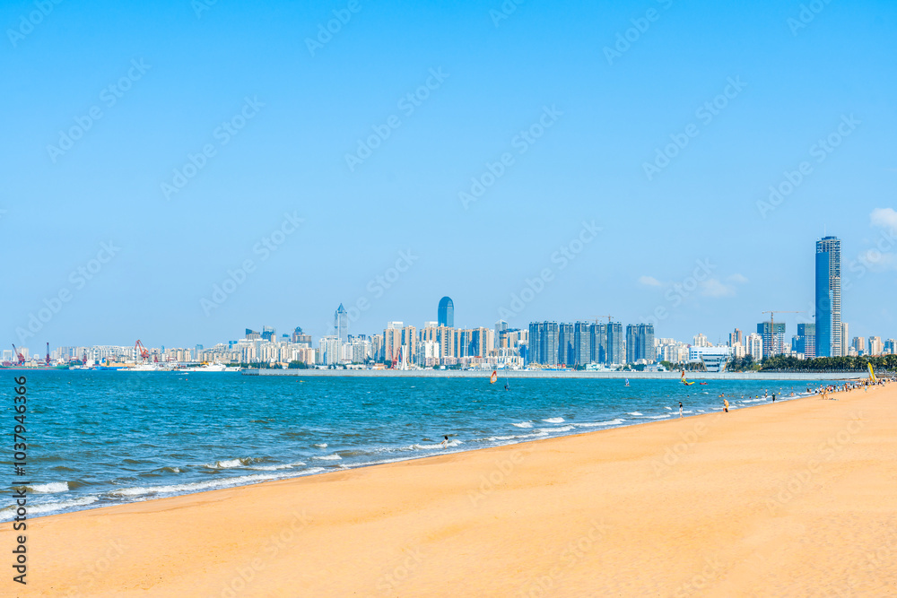 Scenery of Holiday Beach and West Coast Tall Buildings in Haikou, Hainan, China Scenery of Holiday Beach and West Coast Tall Buildings in Haikou, Hainan, China