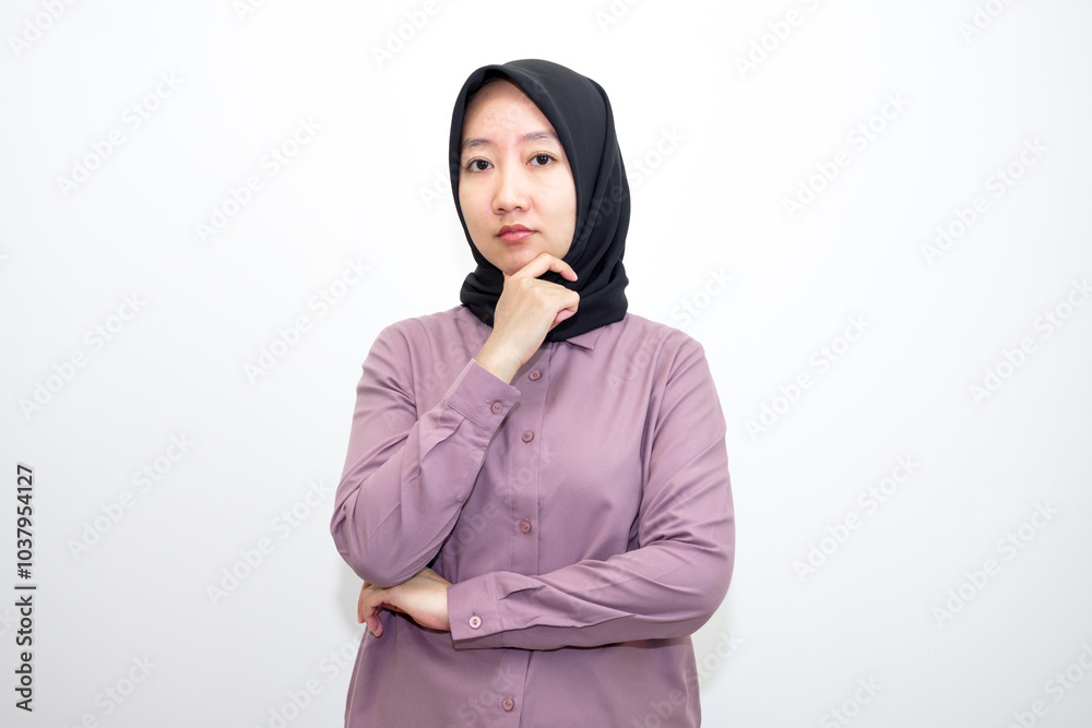 Portrait of Asian, Indonesian woman confused emotion and bad thinking. Unhappy stressed woman. Standing feeling depressed dramatic scene looking for copy space.. Isolated on white background Portrait of Asian, Indonesian woman confused emotion and bad thinking. Unhappy stressed woman. Standing feeling depressed dramatic scene looking for copy space.. Isolated on white background