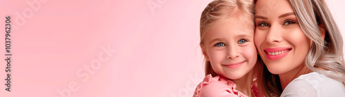 Smiling mother and daughter embracing against a soft pink background. Banner or header 