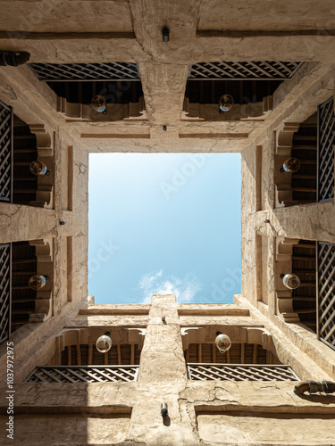 Traditional Arabian Courtyard with Stone Walls and Open Sky Symmetrical Architecture, Latticework and old Style. Al Seef Traditional Historical District Arabic Architecture. Dubai Deira Old Town. UAE