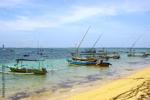 Traditional boats, Jukungs, along the Sanur Beach in Bali, Indonesia  photo