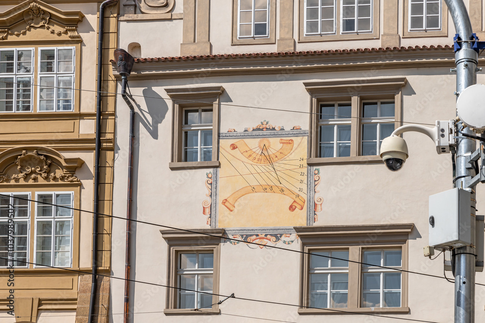 Obraz premium Sundial on the wall of an old building in historical part of the Prague in the Czech Republic