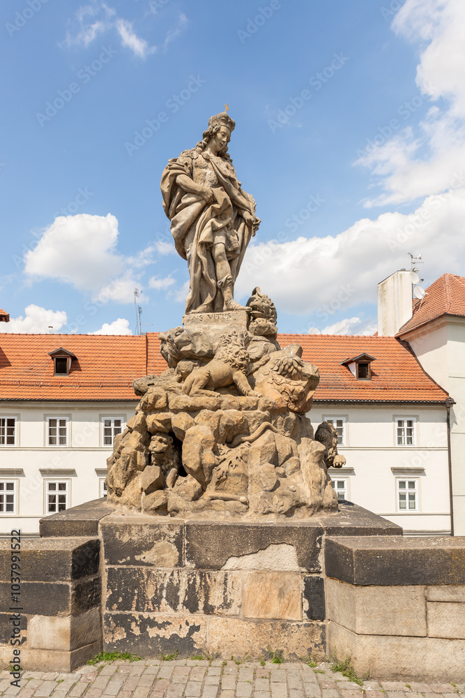Obraz premium Sculpture of St Vitus by Ferdinand Maximilian Brokoff on the Charles Bridge in Prague in Czech Republic