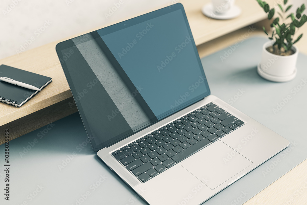Perspective view from top on blank dark modern laptop monitor with abstract reflection on light grey table with green plant and notebook on wooden shelf. 3D rendering, mockup Perspective view from top on blank dark modern laptop monitor with abstract reflection on light grey table with green plant and notebook on wooden shelf. 3D rendering, mockup