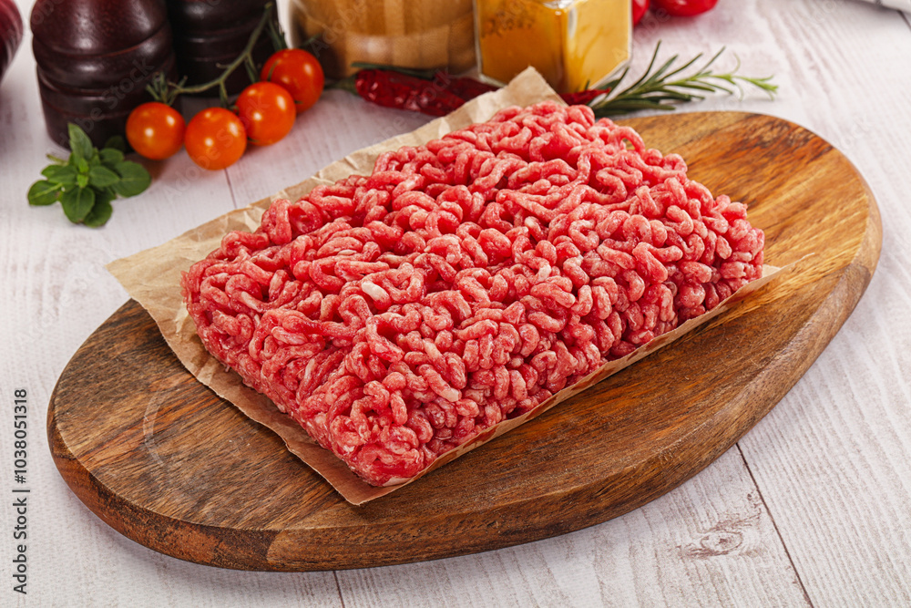 Raw minced beef meat over board Raw minced beef meat over board