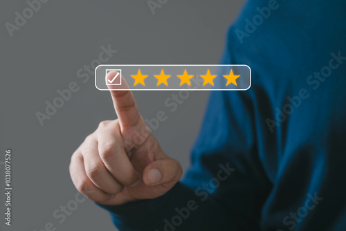 A person confirming a five-star rating, symbolizing satisfaction and positive feedback in a digital environment.