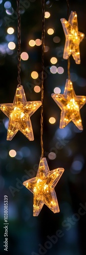 Warm glowing star lights hanging outdoors under a twilight sky surrounded by ...