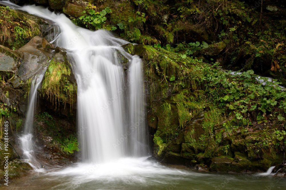 A beautiful waterfall photographed with a long exposure. A beautiful waterfall photographed with a long exposure.