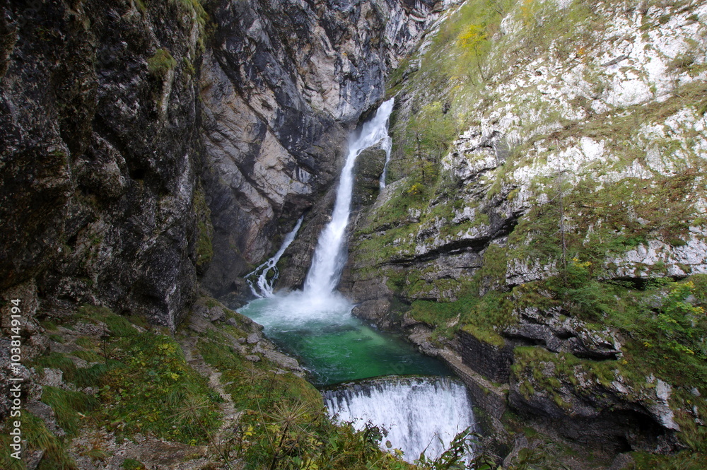 Savica Falls is a waterfall in northwestern Slovenia. It is 78 meters (256 ft) high and is fed by a karst spring also called Savica just above the waterfall.