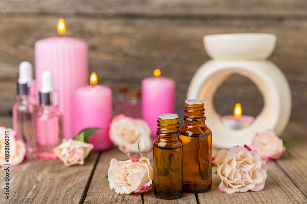 Rose essential oil on a textured background.Roses and a bottle of rose perfumed water.Aromatherapy treatment. Beauty concept. Spa procedure.Natural organic oil.Anti-stress,detox relax.Place for text Rose essential oil on a textured background.Roses and a bottle of rose perfumed water.Aromatherapy treatment. Beauty concept. Spa procedure.Natural organic oil.Anti-stress,detox relax.Place for text