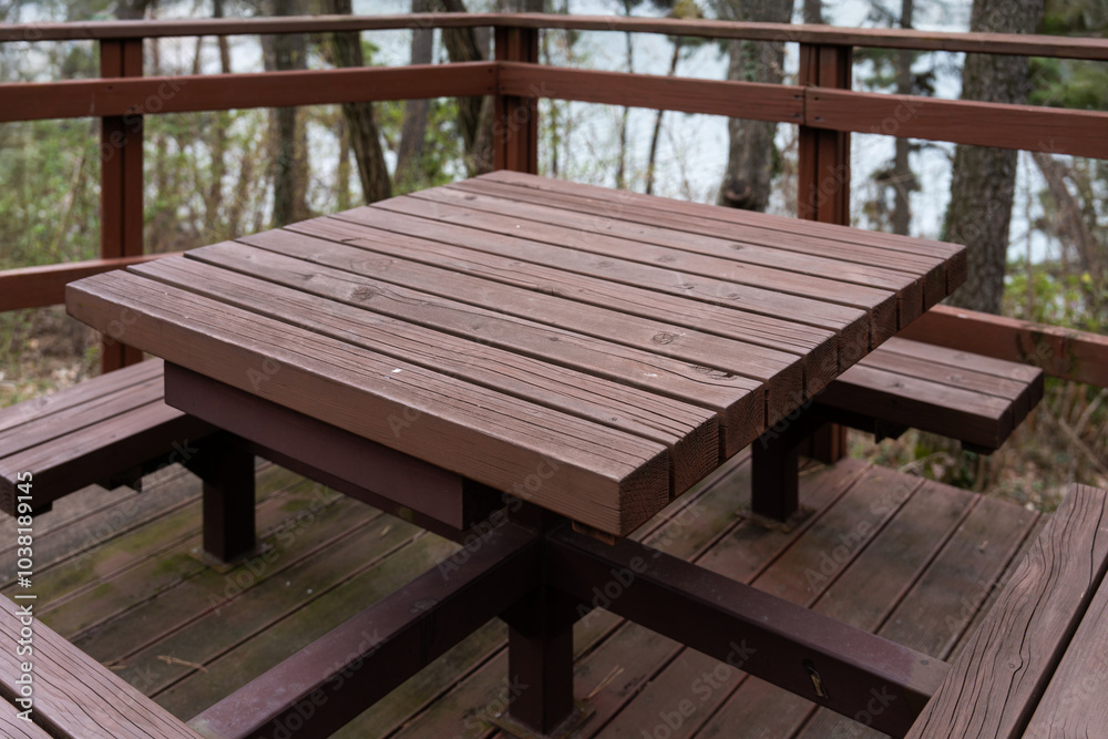 wooden table and seats in the park