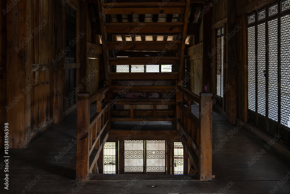 entrance of the stairway in the wooden building entrance of the stairway in the wooden building